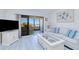Spacious living room with an entertainment center and access to the lanai at 175 Kings Hwy # 232, Punta Gorda, FL 33983