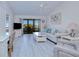 Inviting living room with modern furnishings and a sliding glass door to the lanai at 175 Kings Hwy # 232, Punta Gorda, FL 33983