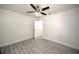 Bedroom featuring light gray floors, a ceiling fan, and neutral paint at 21229 Giddings Ave, Port Charlotte, FL 33952