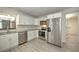 Modern kitchen featuring stainless steel appliances, white cabinetry, and ample counter space at 21229 Giddings Ave, Port Charlotte, FL 33952