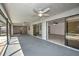 Large screened lanai with ceiling fans and sliding doors to pool area and into living spaces at 21229 Giddings Ave, Port Charlotte, FL 33952