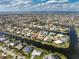 Picturesque aerial view of canal homes, emphasizing the neighborhood's unique waterfront appeal at 2181 Via Seville, Punta Gorda, FL 33950