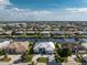 Neighborhood aerial view of the house with waterfront access and a community of canal-front homes at 2181 Via Seville, Punta Gorda, FL 33950