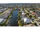 Stunning aerial view of canal-front homes, showcasing waterfront living and neighborhood layout at 2181 Via Seville, Punta Gorda, FL 33950