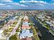 Beautiful aerial view of a waterfront home featuring a private boat dock and canal access at 2181 Via Seville, Punta Gorda, FL 33950