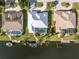 Overhead view of waterfront property featuring boat dock, pool, and well-maintained landscaping at 2181 Via Seville, Punta Gorda, FL 33950