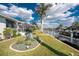 Waterfront home featuring a boat dock, lush landscaping, and a screened-in lanai for enjoying the beautiful scenery at 2181 Via Seville, Punta Gorda, FL 33950