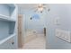 Bright bathroom showcasing a built-in shower, tub, and vanity, complemented by seashell accents at 2181 Via Seville, Punta Gorda, FL 33950