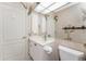 Bathroom featuring a vanity, decorative wallpaper, and adjacent toilet at 2181 Via Seville, Punta Gorda, FL 33950
