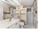Bathroom featuring a vanity with decorative wallpaper and walk-in shower at 2181 Via Seville, Punta Gorda, FL 33950