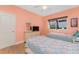 Cozy bedroom with two beds, natural light, and a dresser with TV at 2181 Via Seville, Punta Gorda, FL 33950