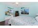 Bright bedroom featuring pool view through glass doors, and a ceiling fan at 2181 Via Seville, Punta Gorda, FL 33950