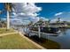 Home features a private boat dock and lift with easy access to waterways at 2181 Via Seville, Punta Gorda, FL 33950