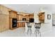 Well-appointed kitchen with wood cabinets, granite countertops, and stainless steel appliances at 2181 Via Seville, Punta Gorda, FL 33950