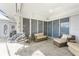 Screened in lanai features a hanging chair, sofa and tile floors at 2181 Via Seville, Punta Gorda, FL 33950