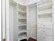 Spacious walk-in closet with custom shelves, drawers, and ample hanging space at 2181 Via Seville, Punta Gorda, FL 33950