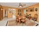 Warm dining room with a wooden table, chairs, and a view into the hallway at 22490 Westchester Blvd, Punta Gorda, FL 33980