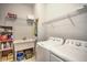 Functional laundry room equipped with a utility sink, washer, and dryer at 24064 Riverfront Dr, Punta Gorda, FL 33980