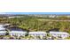 Scenic aerial view of condo buildings overlooking lake and lush greenery at 25050 Sandhill Blvd # B2 Building 6, Punta Gorda, FL 33983