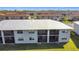 Aerial view of condo buildings, highlighting the roof and community setting at 25050 Sandhill Blvd # B2 Building 6, Punta Gorda, FL 33983