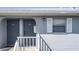Close-up of condo entrances with gray doors and white trim at 25050 Sandhill Blvd # B2 Building 6, Punta Gorda, FL 33983