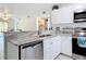 Bright kitchen features stainless steel appliances, granite countertops and white cabinetry at 25050 Sandhill Blvd # B2 Building 6, Punta Gorda, FL 33983