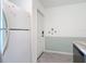 Clean kitchen with white appliances, and gray wood-look floors at 25050 Sandhill Blvd # B2 Building 6, Punta Gorda, FL 33983