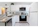 Updated kitchen with stainless steel appliances and ample countertop space at 25050 Sandhill Blvd # B2 Building 6, Punta Gorda, FL 33983