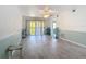 Bright living room with sliding glass doors opening to a balcony with lots of natural light at 25050 Sandhill Blvd # B2 Building 6, Punta Gorda, FL 33983