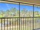 Screened patio offers serene water view, perfect for relaxation and nature at 25050 Sandhill Blvd # B2 Building 6, Punta Gorda, FL 33983