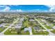 Wide aerial view showcasing the property in a well-maintained neighborhood with mature landscaping at 25069 Bolivar Dr, Punta Gorda, FL 33983