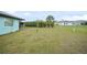 Expansive backyard with a lush green lawn, providing plenty of space at 25069 Bolivar Dr, Punta Gorda, FL 33983
