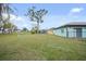 Large backyard with plenty of grass, a fence, and surrounding homes, offering ample outdoor space at 25069 Bolivar Dr, Punta Gorda, FL 33983