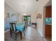 Dining room with wood floors and blue accent wall at 25069 Bolivar Dr, Punta Gorda, FL 33983