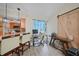 Cozy office nook showcasing a barn door and a view into the kitchen with pendant lighting at 25069 Bolivar Dr, Punta Gorda, FL 33983