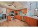 Bright kitchen with stainless steel appliances, wooden cabinets, and a granite countertop at 25069 Bolivar Dr, Punta Gorda, FL 33983