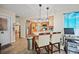 Modern eat-in kitchen with stainless steel appliances, breakfast bar, and wood-look flooring at 25069 Bolivar Dr, Punta Gorda, FL 33983