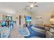 Open concept living area with dining room and beach-themed decor at 25069 Bolivar Dr, Punta Gorda, FL 33983