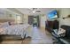 Spacious bedroom with ceiling fan, light-colored walls, and wood-look flooring at 25069 Bolivar Dr, Punta Gorda, FL 33983