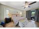Relaxing main bedroom features a plush bed and natural light at 25069 Bolivar Dr, Punta Gorda, FL 33983