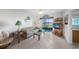 Inviting living room with cozy seating, serene water views, and stylish decor, perfect for relaxation and entertaining at 25275 Rampart Blvd # 1602, Punta Gorda, FL 33983