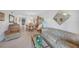 Comfortable living room featuring tile floors, cozy furniture, and an open layout to the kitchen and dining area at 25275 Rampart Blvd # 1602, Punta Gorda, FL 33983