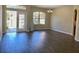 Open living area with new flooring, natural light, and open doorway to kitchen at 2676 Dongola St, North Port, FL 34291