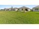 Large backyard showing the well-maintained lawn and surrounding homes at 3860 Cobblestone Ln, Punta Gorda, FL 33980