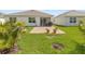 Wide backyard with a view of the outdoor patio area and large grassy lawn at 3860 Cobblestone Ln, Punta Gorda, FL 33980