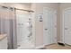 Bathroom showcasing a tiled walk-in shower, neutral decor and modern fixtures at 3860 Cobblestone Ln, Punta Gorda, FL 33980