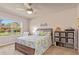 Cozy bedroom with large window, comfortable bed, and decorative accents, creating a relaxing atmosphere at 3860 Cobblestone Ln, Punta Gorda, FL 33980