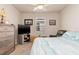 Cozy bedroom featuring a ceiling fan, dresser, TV, window with blinds and a leather recliner at 3860 Cobblestone Ln, Punta Gorda, FL 33980