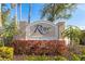 Beautiful entrance sign for River Club Community framed by beautiful landscaping at 3860 Cobblestone Ln, Punta Gorda, FL 33980