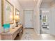 Inviting foyer with tile flooring, neutral paint and arched doorways leading to other living spaces at 3860 Cobblestone Ln, Punta Gorda, FL 33980